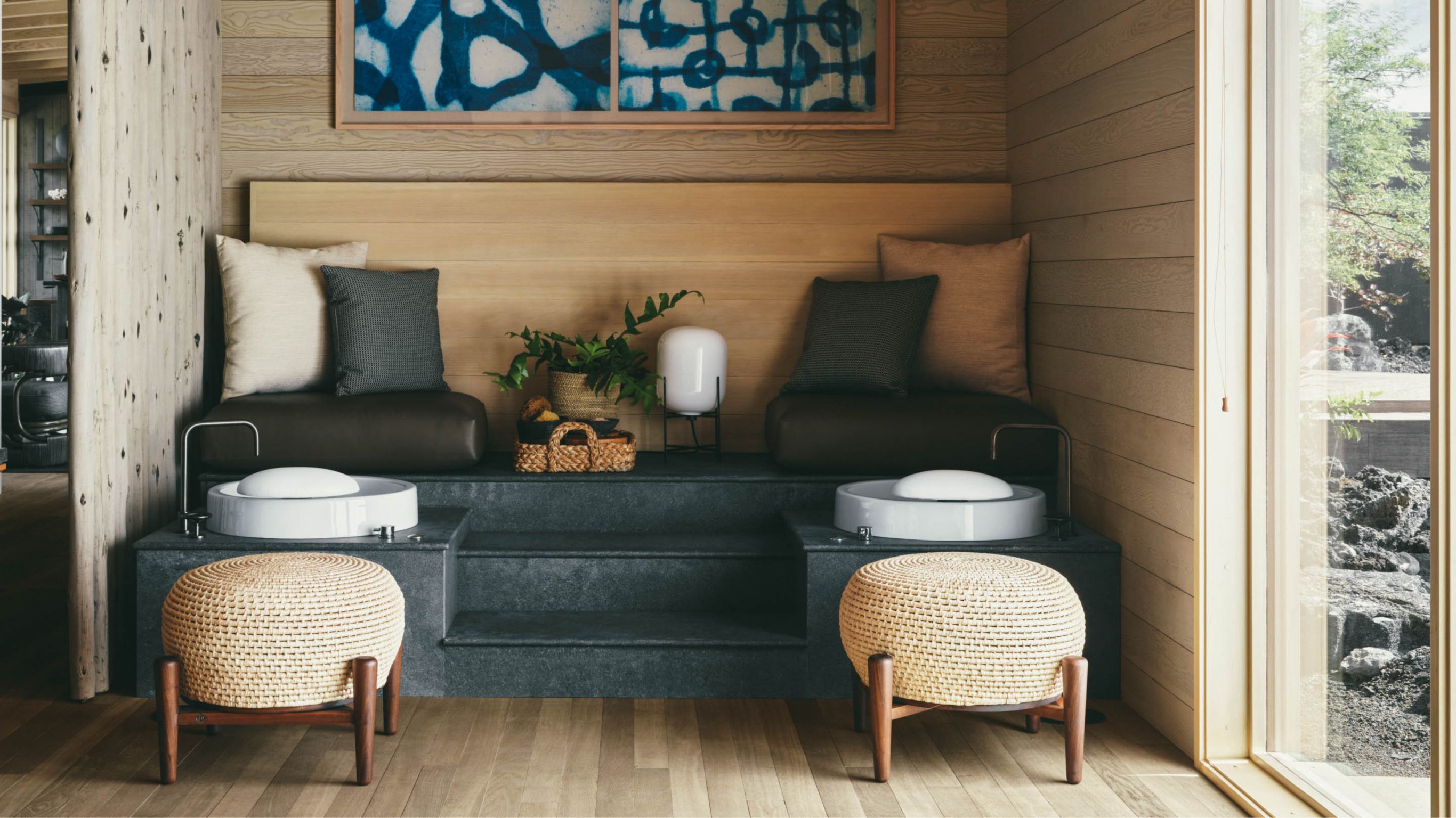 A relaxing spa pedicure area with cushioned  seats designed for two guests.